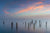 Decaying pilings covered in fog and sunset over the Boston Harbor - Massachusetts